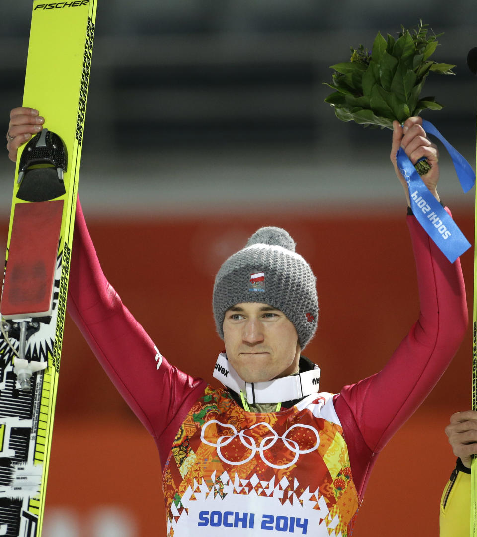 Poland's Kamil Stoch celebrates winning the gold after the ski jumping large hill final at the 2014 Winter Olympics, Saturday, Feb. 15, 2014, in Krasnaya Polyana, Russia. (AP Photo/Gregorio Borgia)