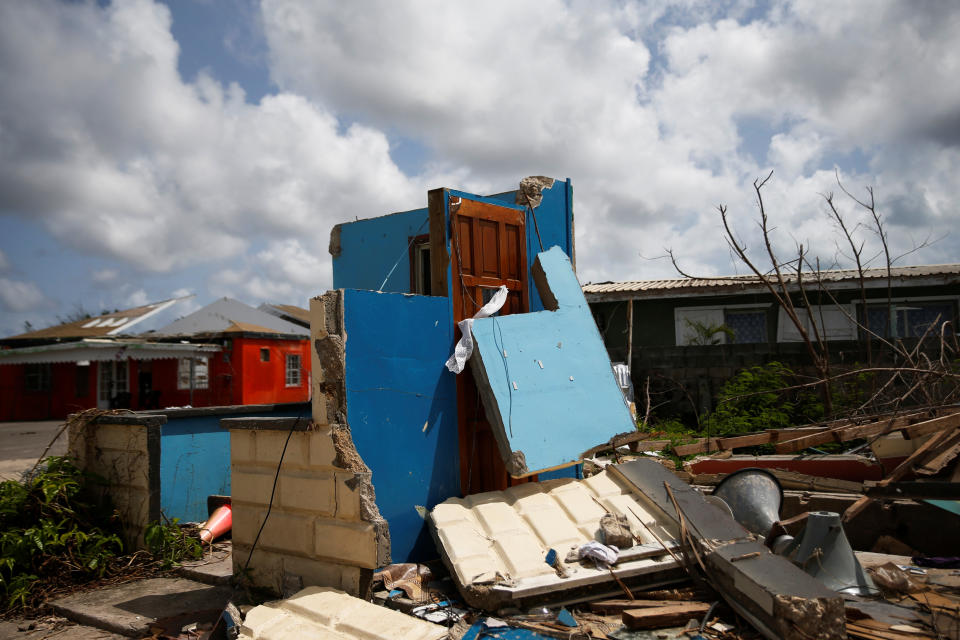 Homes sit in ruins at Codrington on the island of Barbuda just after a month after Hurricane Irma struck the Caribbean islands of Antigua and Barbuda