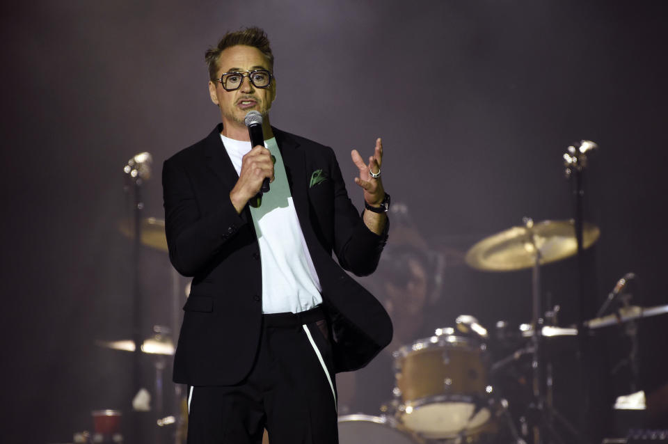 Actor Robert Downey Jr. addresses the crowd before the Rolling Stones concert at the Rose Bowl, Thursday, Aug. 22, 2019, in Pasadena, Calif. Downey announced that NASA has officially named a rock spotted rolling across the surface of Mars by its InSight lander "Rolling Stones Rock." (Photo by Chris Pizzello/Invision/AP)