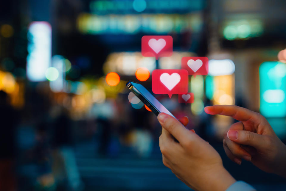 woman looking at social media on a smartphone