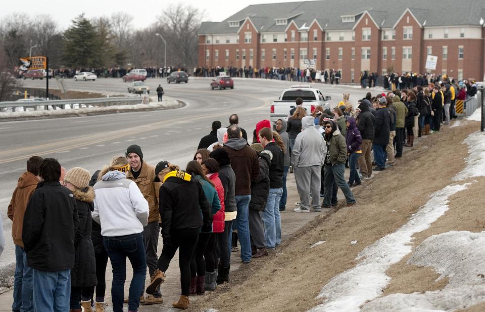 Several hundred supporters of Michael Sam stand along Stadium Boulevard across the street from Memorial Stadium Saturday, Feb. 15, 2014, in Columbia, Mo. (AP Photo/L.G. Patterson)