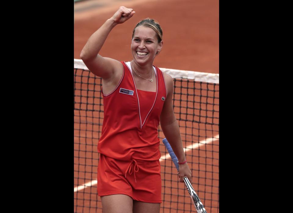 Slovakia's Dominika Cibulkova waves after winning over Belarus Victoria Azarenka their Women's Singles 4th Round tennis match of the French Open in Paris.      (JACQUES DEMARTHON/AFP/GettyImages)