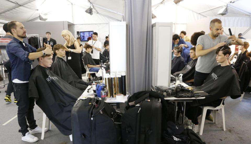 Models are being made up before Vuitton's Spring-Summer 2014 men's fashion collection to be presented Thursday, June 27, 2013 in Paris. (AP Photo/Jacques Brinon)