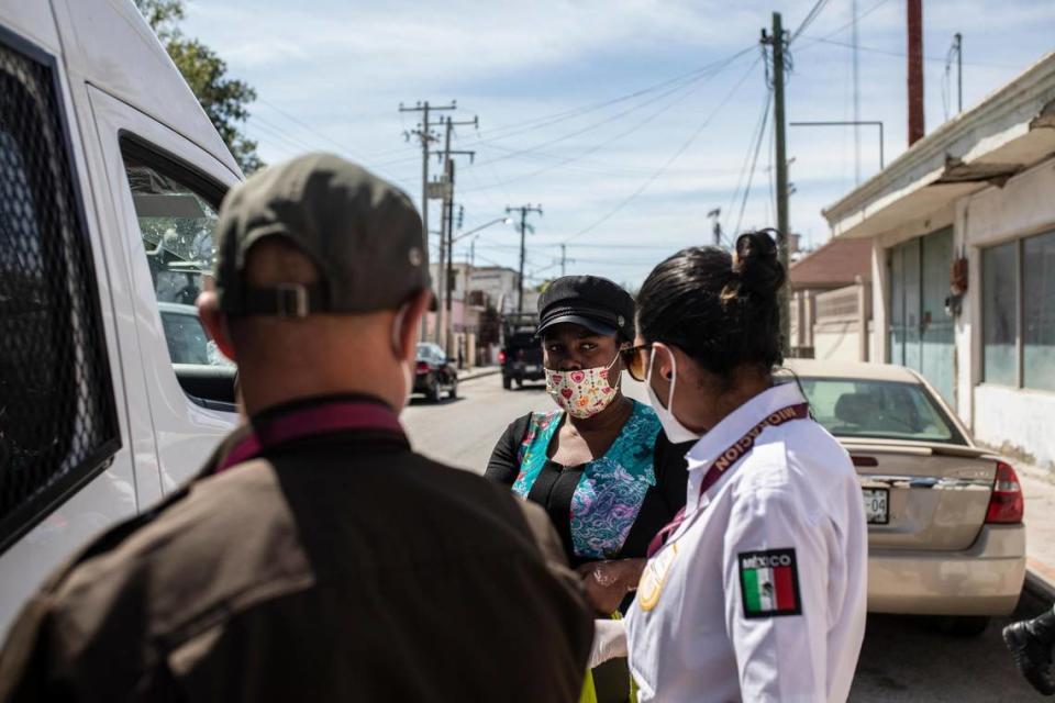 A migrant from Haiti is detained by Mexican immigration officers in Ciudad Acuña, Mexico, Wednesday, Sept. 22, 2021, near the U.S. border in Texas.