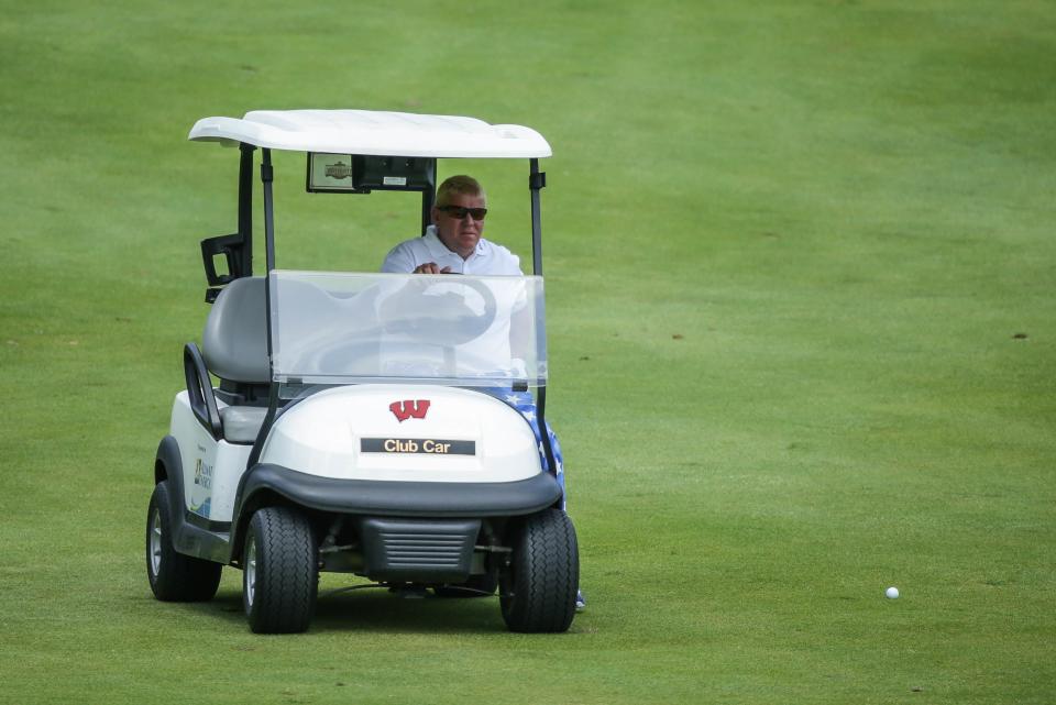 MADISON, WI - JUNE 24: John Daly drives a cart to his ball on the 18th hole during the first round of the Champions Tour American Family Insurance Championship at University Ridge Golf Course on June 24, 2016 in Madison, Wisconsin. (Photo by Hunter Martin/Getty Images)