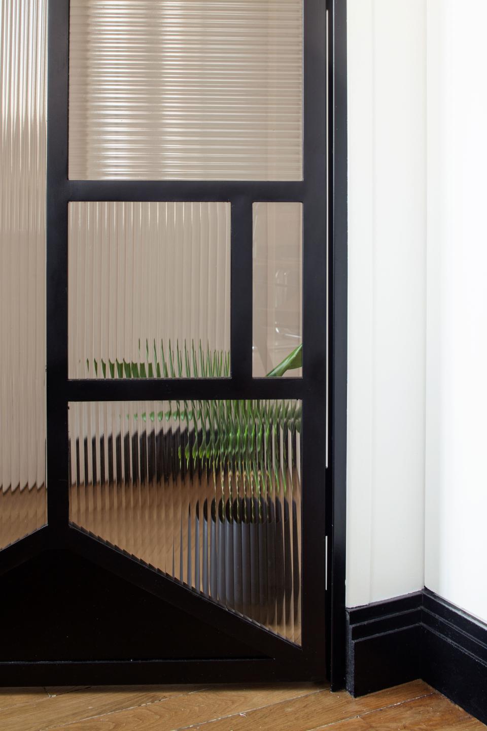 Glass doors brighten areas that otherwise don’t see much sunlight.