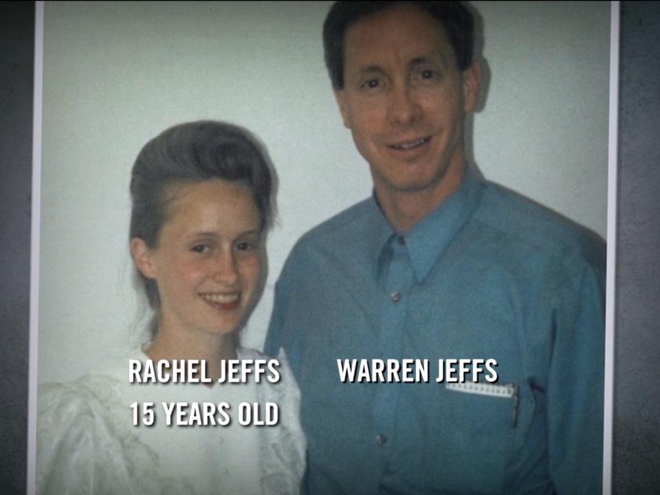 A photo of Rachel Jeffs, in a white dress and voluminous hairstyle, posing with father Warren Jeffs, in a blue shirt, from when Rachel was 15 years old.