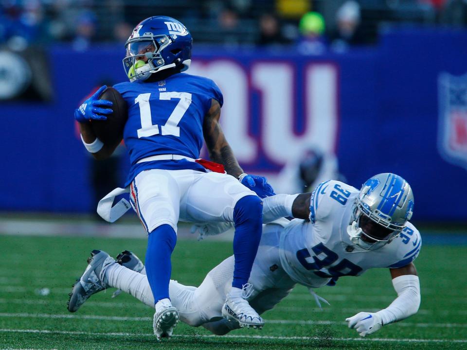 Wan'Dale Robinson is tackled after a catch against the Detroit Lions.