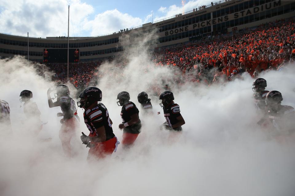 Oklahoma State takes the field before a Bedlam college football game between the Oklahoma State University Cowboys (OSU) and the University of Oklahoma Sooners (OU) at Boone Pickens Stadium in Stillwater, Okla., Saturday, Nov. 4, 2023. Oklahoma State won 27-24.