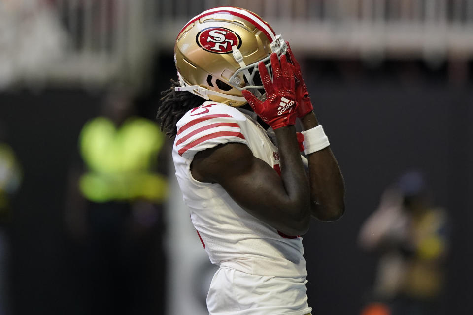 San Francisco 49ers wide receiver Brandon Aiyuk (11) reacts to his touchdown against the Atlanta Falcons during the first half of an NFL football game, Sunday, Oct. 16, 2022, in Atlanta. (AP Photo/Brynn Anderson)