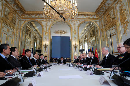 French President Emmanuel Macron attends a meeting with Chinese President Xi Jinping at the Elysee Palace in Paris, France, March 25, 2019. REUTERS/Gonzalo Fuentes/Pool