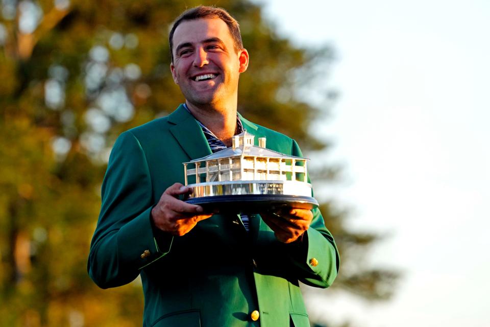 Scottie Scheffler holds his replica Masters Trophy at the Green Jacket Ceremony on Sunday afternoon after winning the Masters Tournament. Rob Schumacher-USA TODAY Sports