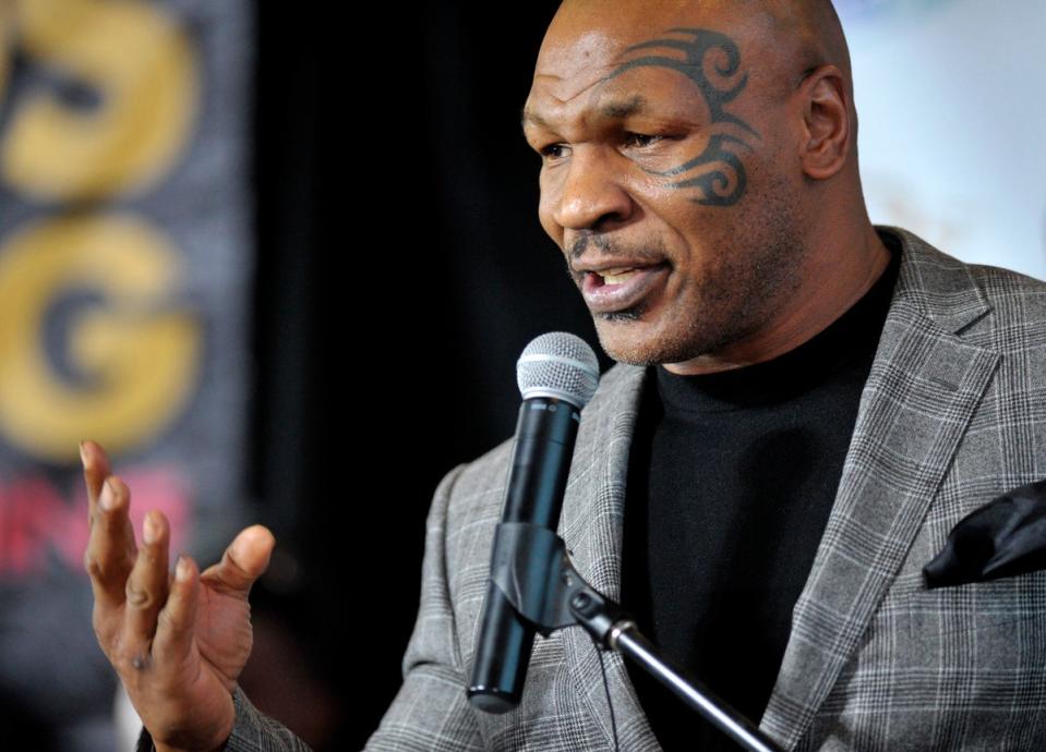 Mike Tyson is being sued by a woman who says she suffered ‘physical, psychological and emotional injury’ after being raped by the former boxer in the 1990s (AP)