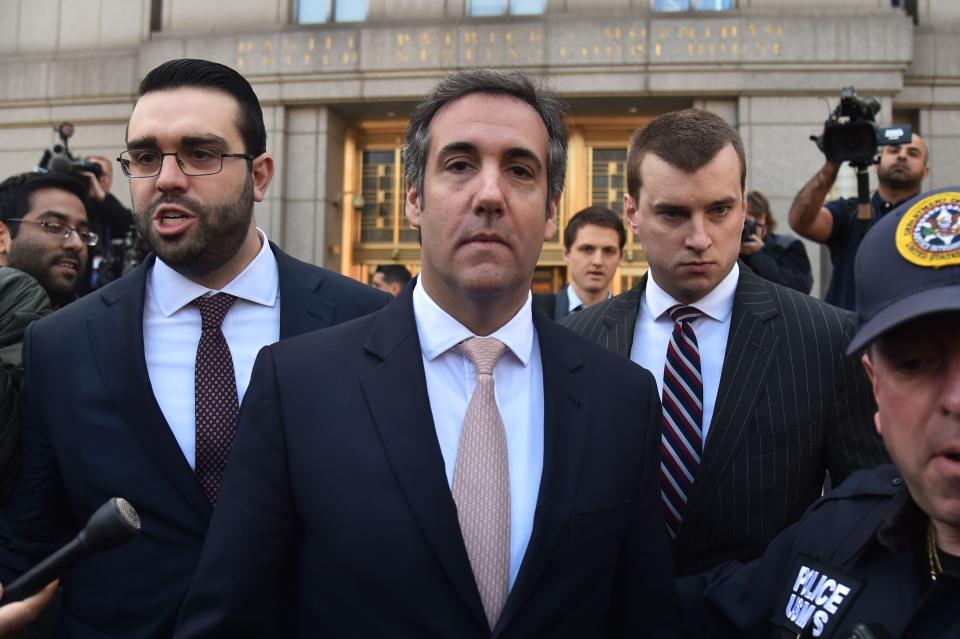 US President Donald Trump's personal lawyer Michael Cohen(C) leaves the US Courthouse in New York on April 26, 2018.
US President Donald Trump acknowledged on Thursday that his personal lawyer, Michael Cohen, represented him in a "deal" involving porn star Stormy Daniels. Trump had previously denied knowledge of a $130,000 payment Cohen made to Daniels that she claims was to prevent her from talking about their alleged 2006 affair.Trump, in a wide-ranging telephone interview with "Fox and Friends," admitted for the first time that Cohen represented him in a "deal" with Daniels, who has filed a lawsuit seeking to have the "hush agreement" negotiated by Cohen thrown out.
 / AFP PHOTO / HECTOR RETAMALHECTOR RETAMAL/AFP/Getty Images ORG XMIT: 486 ORIG FILE ID: AFP_14C9BX