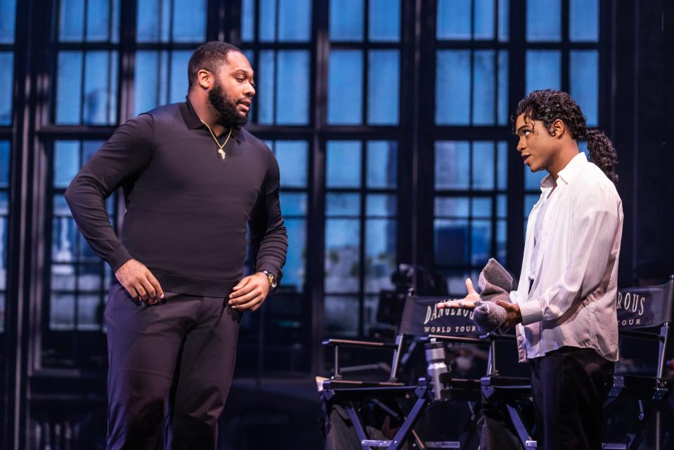 Devin Bowles (left) is seen here as Rob, the beleaguered manager of Michael Jackson, played by Roman Banks in “MJ,” at the Aronoff Center through Sept. 17. Bowles is also seen as Joe Jackson, the young singer’s ferocious and domineering father.