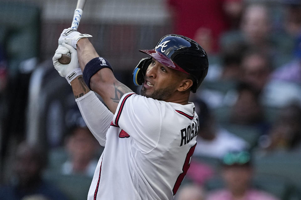 Atlanta Braves' Eddie Rosario watches his two-run home run against the New York Yankees during the second inning of a baseball game Wednesday, Aug. 16, 2023, in Atlanta. (AP Photo/John Bazemore)