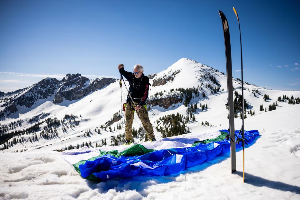 Dan Schilling, a special operations veteran and bestselling author, prepares his wing before speed riding at Alta Ski Area, which has closed for the season, on Wednesday, May 17, 2023. | Spenser Heaps, Deseret News