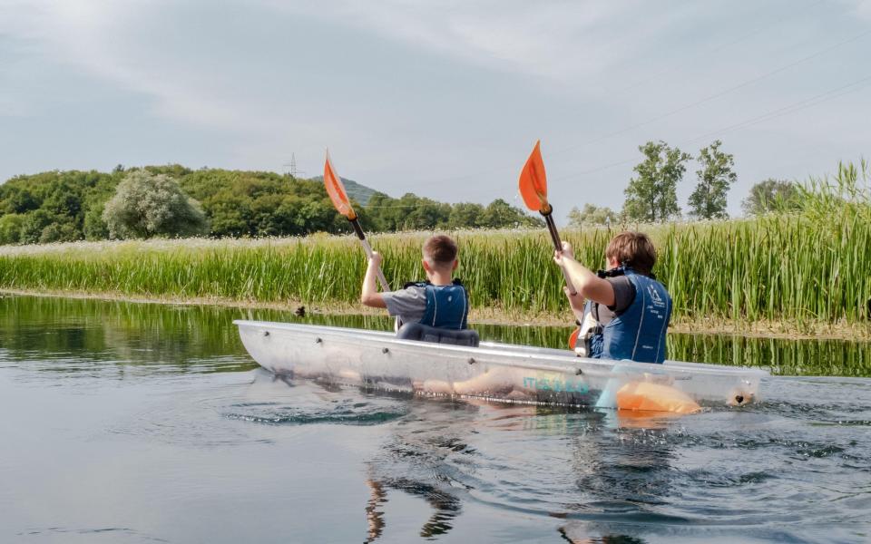 Clear kayaks show off the River Gacka’s sparkling waters