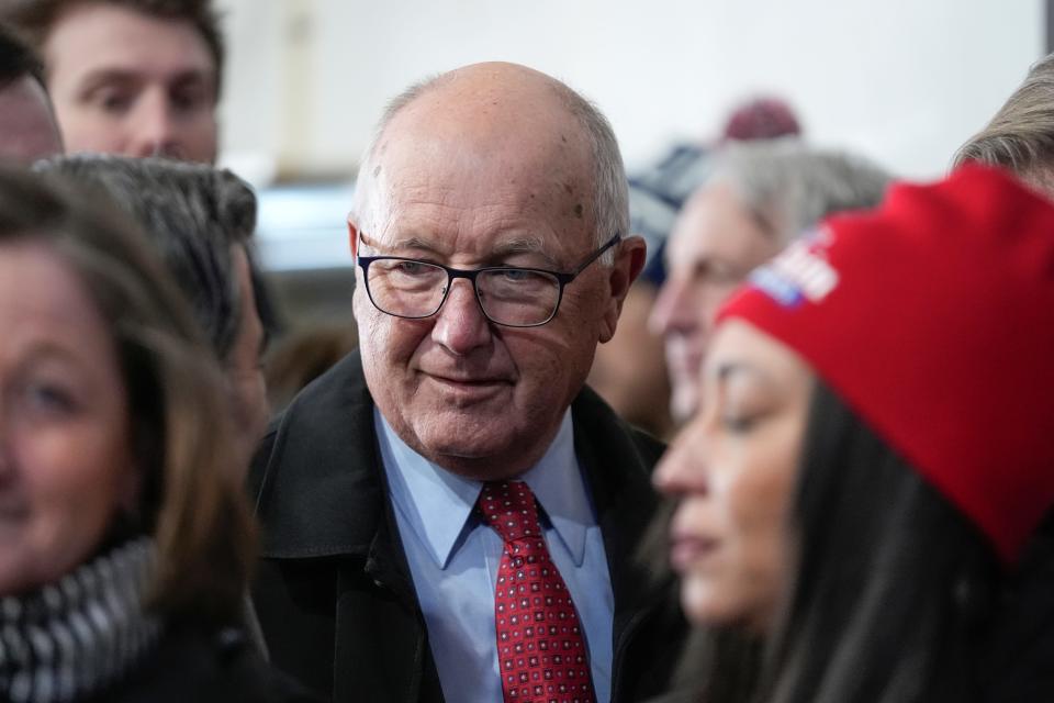 Michigan Republican Party chair Pete Hoekstra talks with people before Republican presidential candidate former President Donald Trump arrives at a campaign rally in Waterford, Mich., Saturday, Feb. 17, 2024