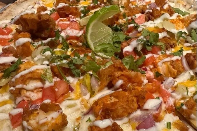 The Twisted Lime Restaurant & Bar in Vero Beach serves a hot chicken flatbread.