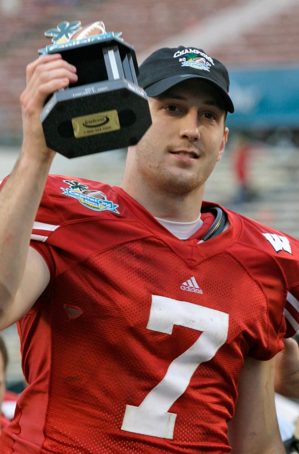 Wisconsin quarterback John Stocco lifts the MVP trophy after the Badgers beat Arkansas in the Jan. 1, 2007, Capital One Bowl.