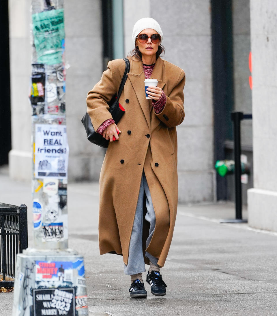 Katie Holmes wearing a camel double-breasted coat while out in NYC