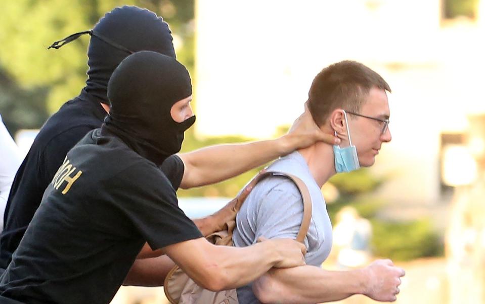  Law enforcement officers detain a person participating in the Ruki Peremen [Hands of Changes] opposition rally ahead of the presidential election - Tass