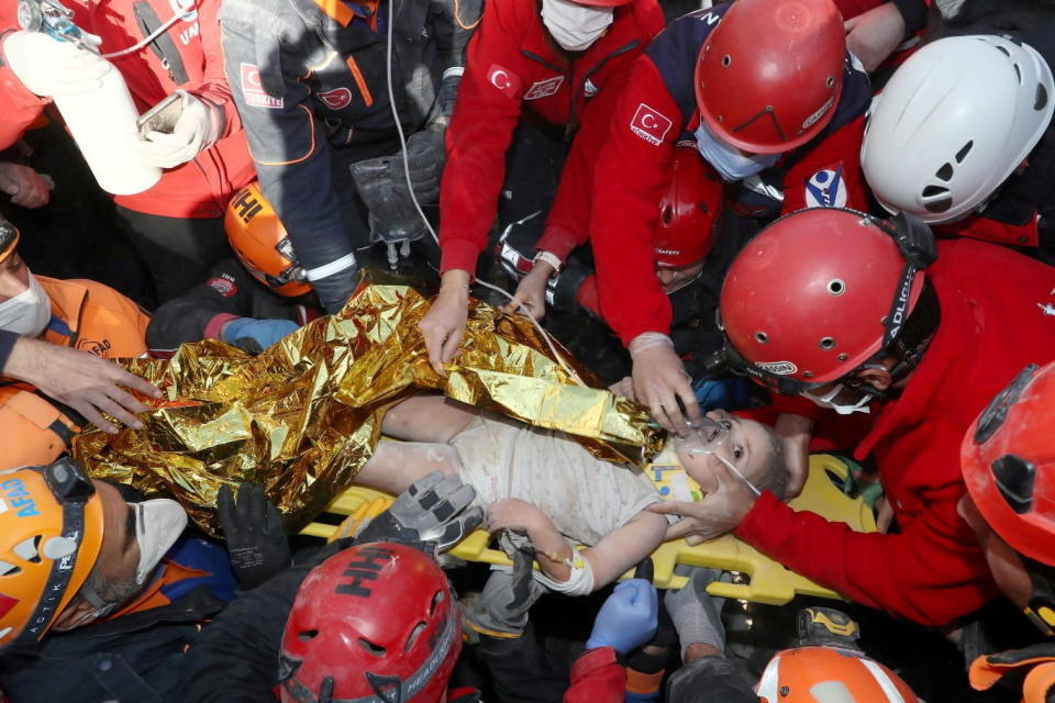 Rescue workers carry 3-year-old Ayda Gezgin out of the rubble of her collapsed apartment building, four days after an earthquake hit Turkey's Aegean port city of Izmir, November 3, 2020. / Credit: Turkey's Disaster and Emergency Management Presidency (AFAD)/Handout/REUTERS