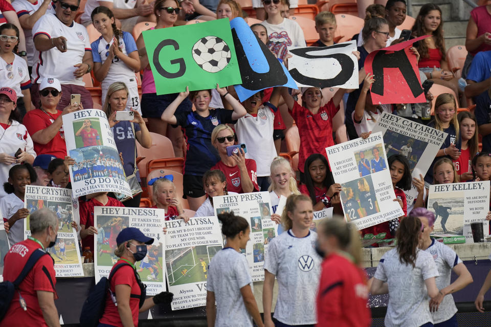 Fans show their support as the U.S. team warms up for an international friendly soccer match against Portugal on Thursday, June 10, 2021, in Houston. (AP Photo/David J. Phillip)