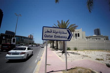 A sign indicating a route to Qatar embassy is seen in Manama, Bahrain, June 5, 2017. REUTERS/Hamad I Mohammed