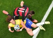 Brazil's defender David Luiz (L) and Germany's forward Miroslav Klose challenge for the ball during the semi-final football match between Brazil and Germany at The Mineirao Stadium in Belo Horizonte on July 8, 2014, during the 2014 FIFA World Cup