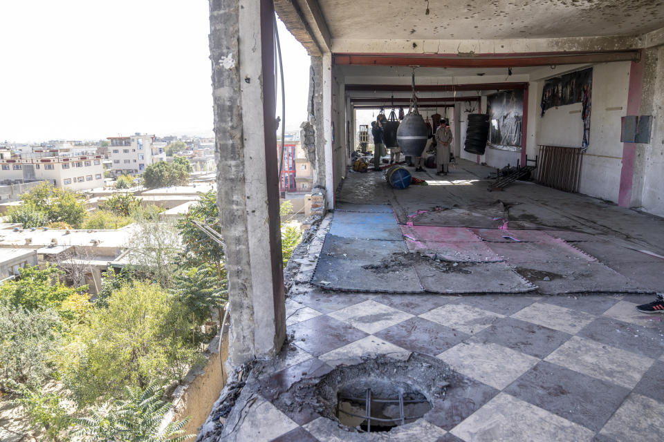 The site of the bomb explosion can be seen in the sports club that was attacked on Thursday night, in the west of Kabul, Afghanistan, Friday, Oct. 27, 2023. (AP Photo/Ebrahim Noroozi)