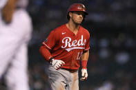 Cincinnati Reds' Kyle Farmer rounds the bases after hitting a solo home run during the fourth inning of a baseball game against the Chicago Cubs, Monday, July 26, 2021, in Chicago. (AP Photo/Paul Beaty)