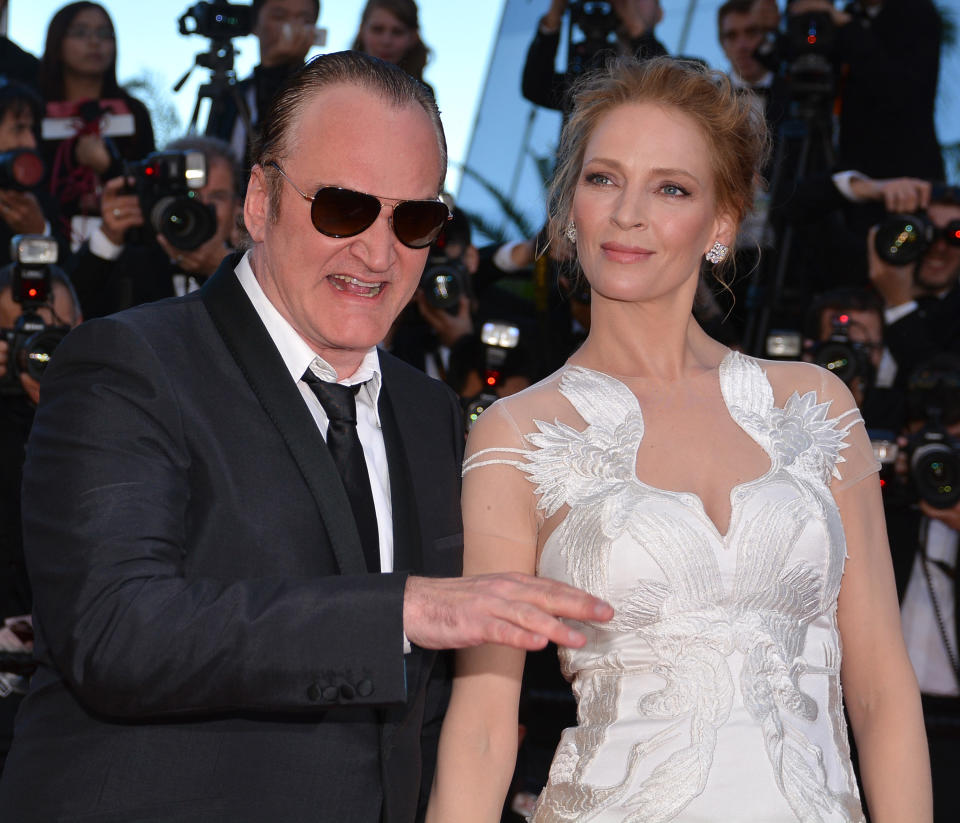 CANNES, FRANCE - MAY 24: US actress Uma Thurman (R) and US director Quentin Tarantino (L) attend the 'Per un pugno di dollari' (A Fistful of Dollars) film screening and the Closing Ceremony of the 67th Cannes Film Festival in Cannes, France on May 24, 2014. (Photo by Mustafa Yalcin/Anadolu Agency/Getty Images)