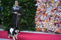 A dog and model attend the Pet Gala fashion show at AKC Museum of The Dog, Monday, May 20, 2024, in New York. (Photo by Charles Sykes/Invision/AP)