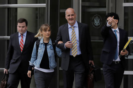 Actress Allison Mack, known for her role in the TV series "Smallville", departs after being granted bail following being charged with sex trafficking and conspiracy in New York, U.S., April 24, 2018. REUTERS/Lucas Jackson
