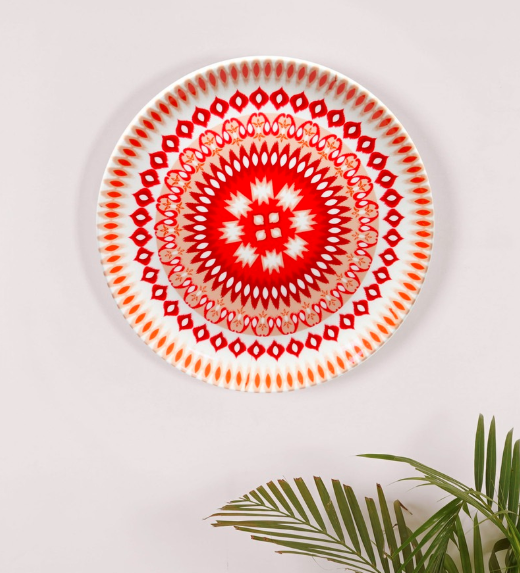 From Indonesia to India, everyone loves a good Ikat weave like this digital interpretation on the <a href="https://fave.co/37SmVp2" rel="noopener" target="_blank" data-ylk="slk:bone china wall plate by Kolorobia;elm:context_link;itc:0;sec:content-canvas" class="link "><strong>bone china wall plate by Kolorobia</strong></a>. <em>Rs.1,489 on offer. </em><a href="https://fave.co/37SmVp2" rel="noopener" target="_blank" data-ylk="slk:Flash sale!;elm:context_link;itc:0;sec:content-canvas" class="link "><strong>Flash sale!</strong></a>