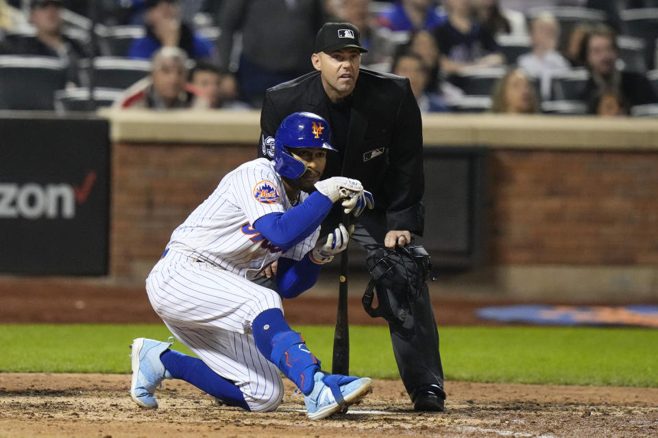 Home Plate umpire Will Little and New York Mets' Francisco Lindor watch a ball hit by Lindor go foul during the eighth inning of the Mets' baseball game against the San Diego Padres on Tuesday, April 11, 2023, in New York. (AP Photo/Frank Franklin II)