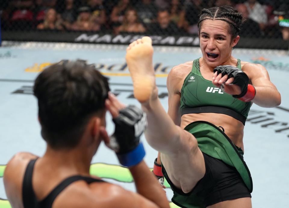 Yazmin Jauregui kicks Iasmin Lucindo at a UFC Fight Night in San Diego.