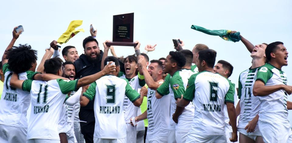 Dallas College-Richland players and coaches hoist the plaque they received after winning the third of the four consecutive NJCAA Division III men's soccer championships they enter the 2022 tournament having won. The Thunderducks defeated Herkimer College in last fall's title match to tie the Generals' Division III record of 10 national championships.