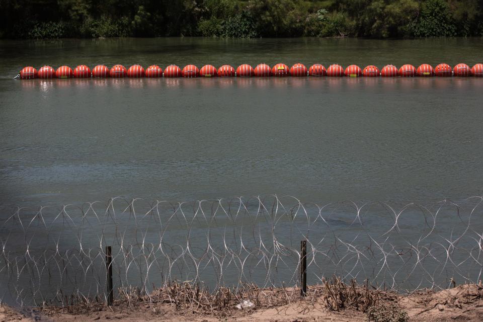 Razor wire and buoys in and around the Rio Grande placed to prevent unauthorized border crossings on Thursday, July 20, 2023, in Eagle Pass, Texas. 