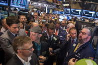 Shopify founder and Chief Executive Officer Tobi Lutke (2nd L, with hat) waits for the company's IPO on the floor of the New York Stock Exchange May 21, 2015. REUTERS/Lucas Jackson