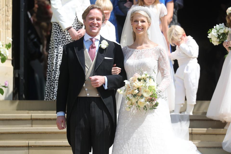 Newlyweds Mr Thomas Kingston and Lady Gabriella Windsor smile on the steps of the chapel after their wedding at St George's Chapel [Photo: Getty]