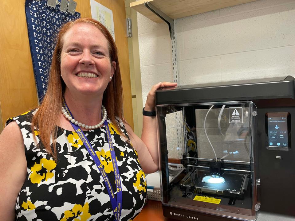 Computer Science/STEM teacher Kristi Shedden seems just as excited as the kids to get two 3D printers to help launch a STEM program at Farragut Intermediate School, May 9, 2024.