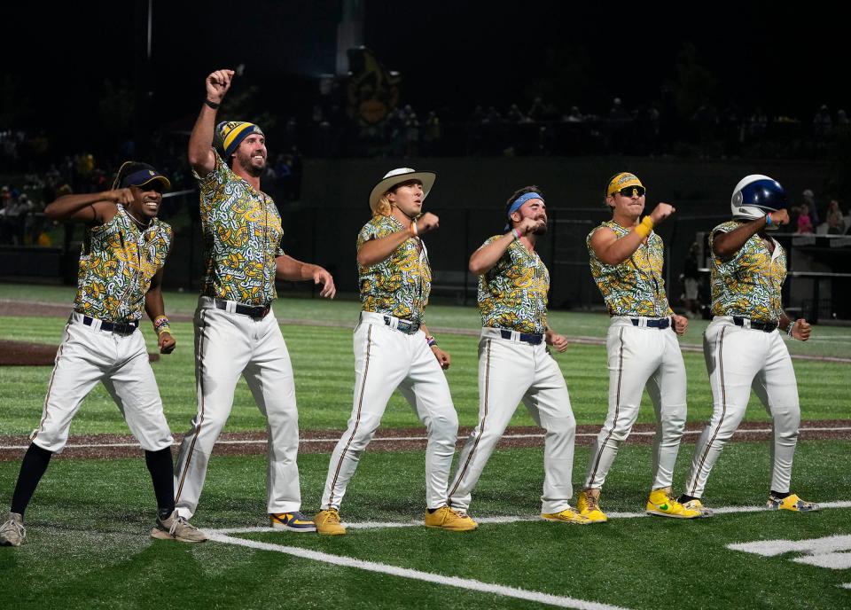 Members of The Savannah Bananas do a dance routine during the exhibition baseball game against the Party Animals at Franklin Field in Franklin on Friday, Sept. 8, 2023.