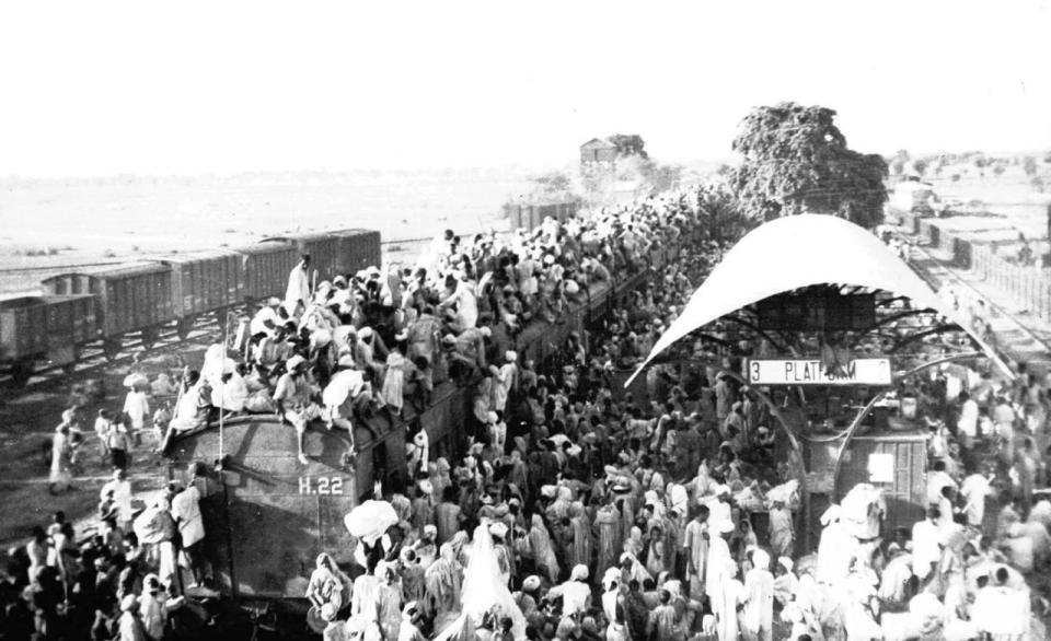 INDIA 70TH ANNIVERSARY: Hundreds of Muslim refugees crowd atop a train leaving New Delhi for Pakistan in this 1947 file photo. India will celebrate its  50th anniversary of Independence from Britian on Friday Aug.  15, 1997. The day also marks the division of the British empire into officially Muslim Pakistan and largely Hindu India. That division was accompanied by bloody religious riots in 1947, the memories of which haunt freedom celebrations. (AP Photo)