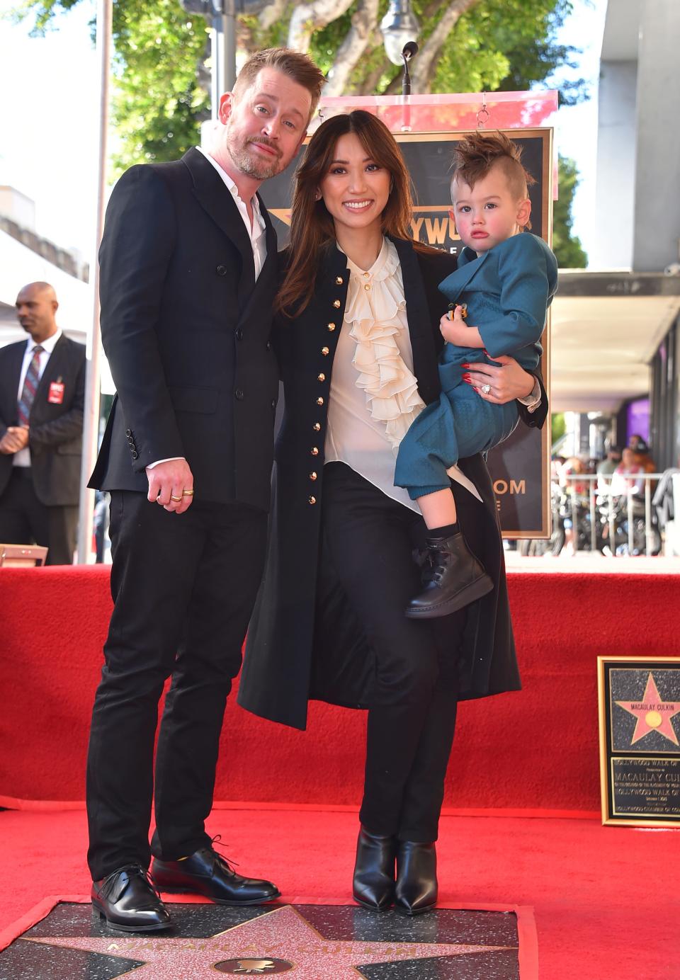 Macaulay Culkin, from left, Brenda Song, and oldest son Dakota Song Culkin pose with Macaulay Culkin's new star.