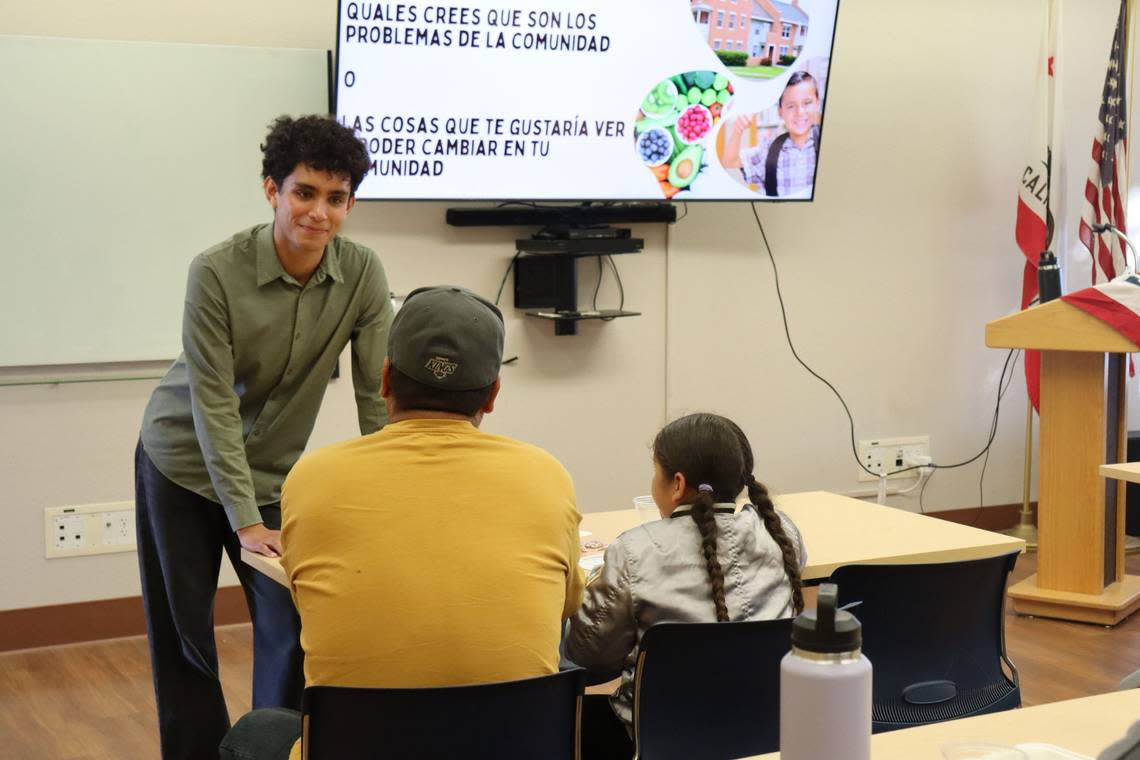 Darius Rogness speaking to Andres Gonzalez at the Nipomo workshop on Sept. 11. Gonzalez has been a U.S. citizen for four years, but he will vote for the first time this November.