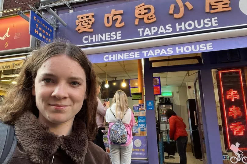 author standing in front of Chinese Tapas House