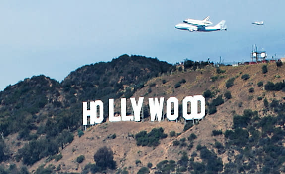 Photographer Olivia Hemaratanatorn captured this view of space shuttle Endeavour soaring over the famed Hollywood sign during its low flyover of Los Angeles on Sept. 21, 2012. Endeavour landed at Los Angeles International Airport and will ultim